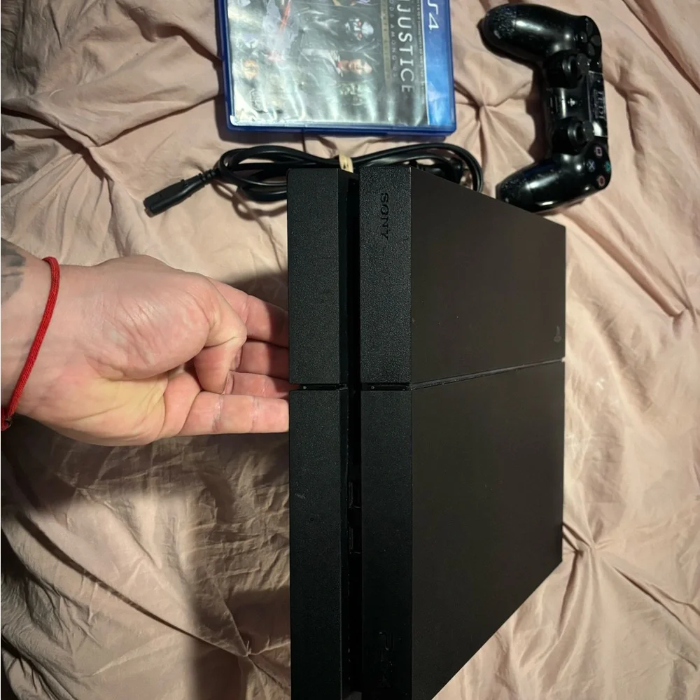 Sony PS4 Console with Black Controller and Game Bundle
